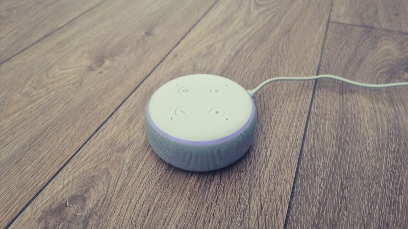 Photo of an upside down alexa with the purple light