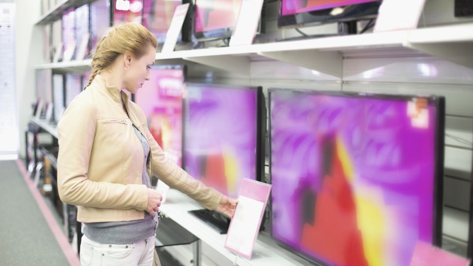 Woman looking at the best anti glare tv in the store